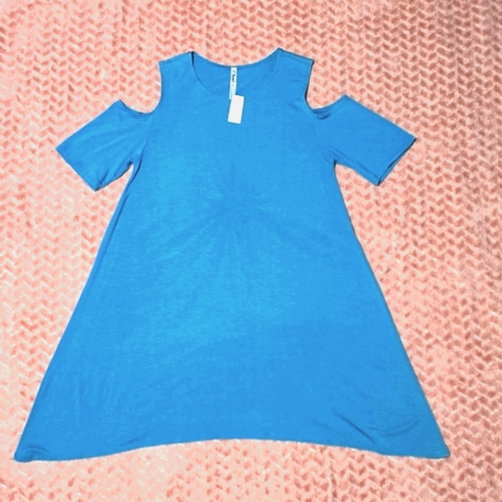 Azules" Teal cold-shoulder top.